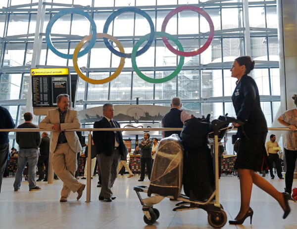 Olympic Rings are revealed during an unveiling ceremony in the Terminal Five arrivals hall at Heathrow Airport, in preparation for the London 2012 Olympic Games in London. Airport unveils Olympic Rings for London Game