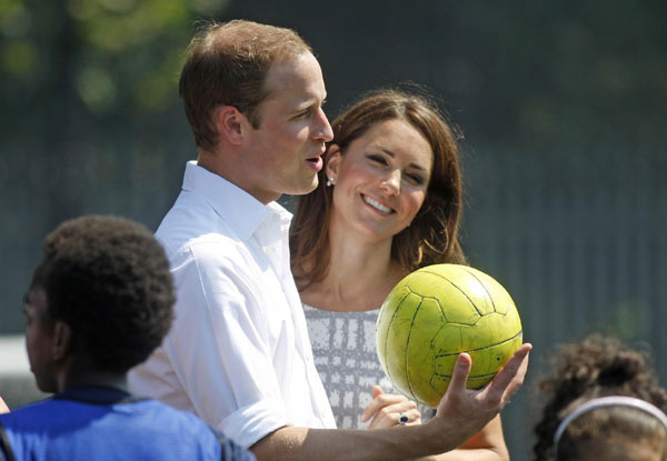 Britain's Prince William, his wife Catherine, Duchess of Cambridge, and Prince Harry show their support to the Games during a visit to Bacon's college to launch the Coach core sports program a day before the London 2012 Olympics opening ceremony in London. British royal family cheers for Olympic Games