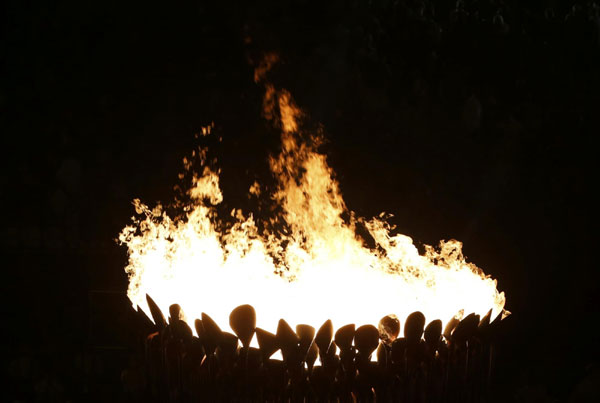 Seven teenagers light Olympic cauldron