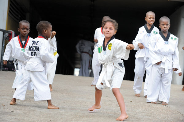 Children put their best fist forward during a taekwondo martial arts class in Lagos, thecapital of Nigeria. Pius Utomi Ekpei / Agence France-Presse Future Olympians