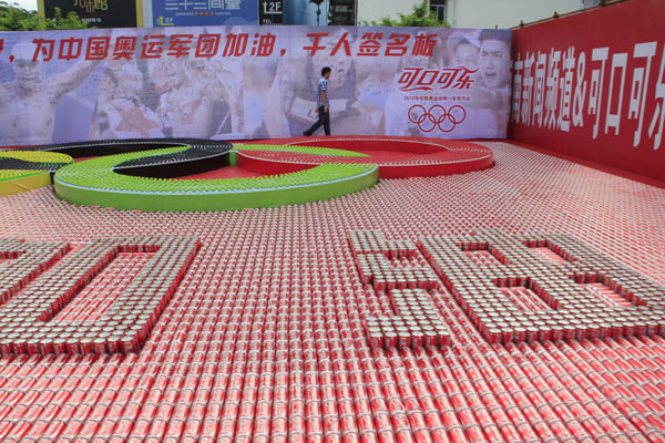 Five Olympic rings and the Chinese characters “Come on China” made by more than 30,000 beverage bottles and cans in Haikou, July 28, 2012. Thirst for Olympic success