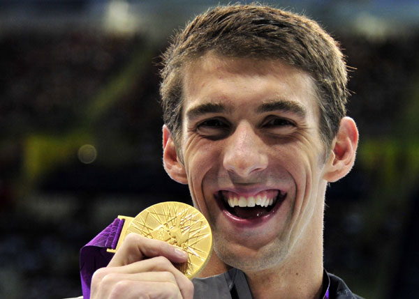 American swimmer Michael Phelps won the men's 100m butterfly on Friday for his 17th Olympic gold and 21st medal overall, as the United States overtook China on the top of the medals table thanks to a gold rush in the pool. Phelps wins 21st medal as US overtakes China