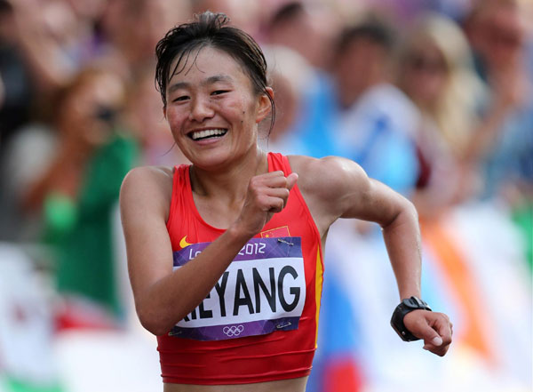 China's Qieyang Shenjie smiles as she finishes third in the women's 20km race walk final at the London 2012 Olympic Games at The Mall August 11, 2012. China cheers for 1st Tibetan Olympic medalist