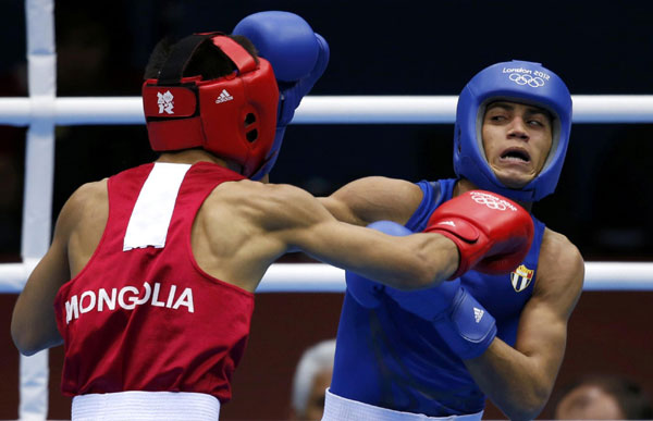 Mongolia's Tugstsogt Nyambayar (L) fights Cuba's Robeisy Ramirez Carrazana during their Men's Fly (52kg) gold medal boxing match at the London Olympics August 12, 2012. Cuban boxer wins boxing men's 52kg gold medal