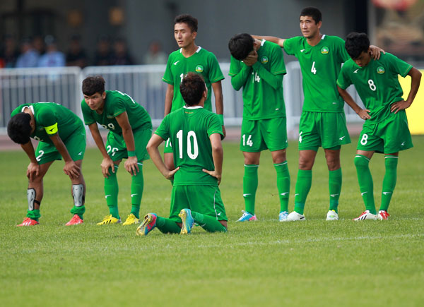The Under-20 soccer team of Xinjiang Uygur autonomous region reacts in a penalty shootout against hosts Liaoning during their first-ever semifinal at the National Games, on Sept 8, 2013. Xinjiang scores on the national stage at last