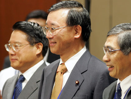 Chinese vice minister of finance Li Yong (L), Japanese Finance Minister Sadakazu Tanigaki (C) and ADB President Haruhiko Kuroda (R) attend a seminar at the Asian Development Bank (ADB) annual meeting in the southern Indian city of Hyderabad May 4, 2006. Finance ministers from China, Japan and South Korea called on Thursday for more financial cooperation among Asian countries and said they would look further into the idea of regional currency units.