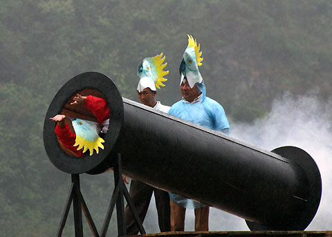 A South Korean military police walks past a signboard showing the distance to North Korean capital Pyongyang from Imjingang Station, of the incomplete inter-Korea railway, near the demilitarized zone which separates the two Koreas, about 55 km (34 miles) north of Seoul, October 6, 2006. 