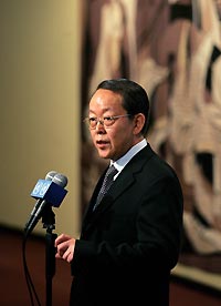 China's ambassador to the United Nations Wang Guangya speaks to reporters after a security council meeting at UN headquarters in New York October 12, 2006. The Security Council met to discuss a possible resolution to the North Korean nuclear situation.