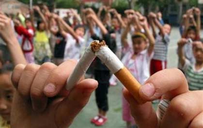 Pupils break cigarettes as a gesture showing their determinations of non-smoking at an elementary school of Jinan, the capital eastern China's Shandong province, in this file photo taken May 29, 2006. China accounts for about half of the global annual death toll from stomach cancer due to the Chinese taste for pickled and smoked food and unabashed enthusiasm for smoking, the official Xinhua news agency said. (Stringer/Reuters)