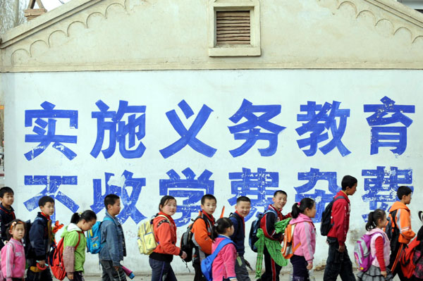 Primary students go home after school in Linze county, Gansu province on March 13, 2008. China's rural achievements in the past decade
