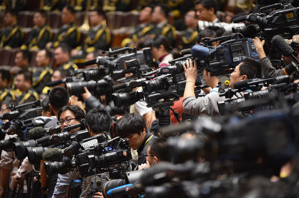 Video journalists cover the opening ceremony of the 18th National Congress of the Communist Party of China (CPC) at the Great Hall of the People in Beijing, capital of China, Nov 8, 2012. Journalists cover opening ceremony of CPC congress