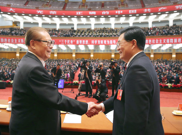 President Hu Jintao and his predecessor Jiang Zemin shake hands as the 18th Party Congress concluded on Wednesday in Beijing. HUA YOU / FOR CHINA DAILY Amendment fine-tunes nation's growth trajectory