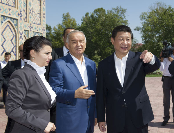 President Xi Jinping, right, visits the ancient Ulugh Beg Observatory with the company of Uzbekistan's President Islam Karimov, center, in Samarkand, Uzbekistan, Sept 10, 2013. Xi 'travels in time' along the ancient trade route