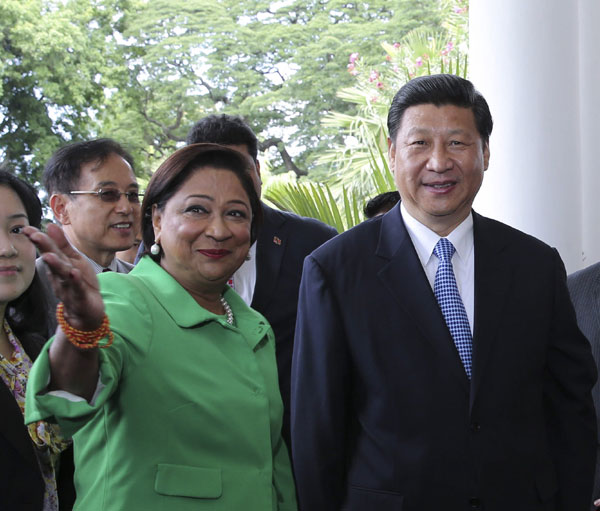 President Xi Jinping (R) is welcomed by Prime Minister of Trinidad and Tobago Kamla Persad-Bissessar before their talks in Port of Spain, Trinidad and Tobago, June 1, 2013. Trinidad and Tobago PM hails Chinese dream