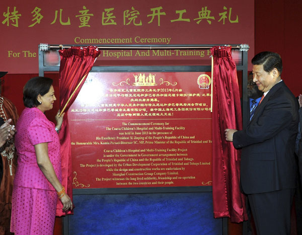 President Xi and Prime Minister of Trinidad and Tobago Kamla Persad-Bissessar, left, attend the unveiling ceremony marking the start of the construction of a children's hospital by a Chinese company in the central city of Couva, Trinidad and Tobago, June 1, 2013. Xi calls for legislative exchanges with Trinidad and Tobago