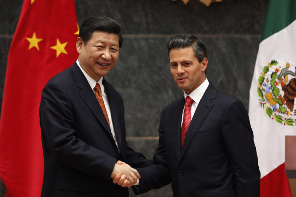 Mexico's President Enrique Pena Nieto shakes hands with President Xi Jinping during a news conference at Los Pinos Presidential Palace in Mexico City June 4, 2013. Xi's trip new chapter for China-Latin American ties
