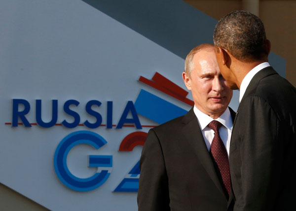 Russia's President Vladimir Putin (L) welcomes U.S. President Barack Obama before the first working session of the G20 Summit in Constantine Palace in Strelna near St. Petersburg, September 5, 2013. Obama, Putin meet for G20 at St petersburg