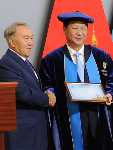 President Xi Jinping (R) shakes hands with his Kazakh counterpart Nursultan Nazarbayev (L) after being awarded an honorary Doctorate from the Nazarbayev University in Astana, on Sept 7, 2013. Xi proposes a 'new Silk Road' with Central Asia