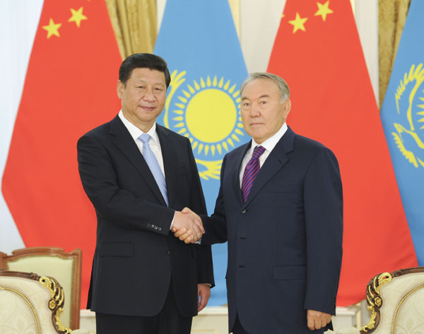 President Xi Jinping (L) shakes hands with his Kazakh counterpart Nursultan Nazarbayev prior to their talks in Astana, Kazakhstan, Sept 7, 2013. China, Kazakhstan agree to strengthen bilateral ties