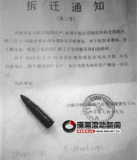 Demolition notice with bullet in N. China