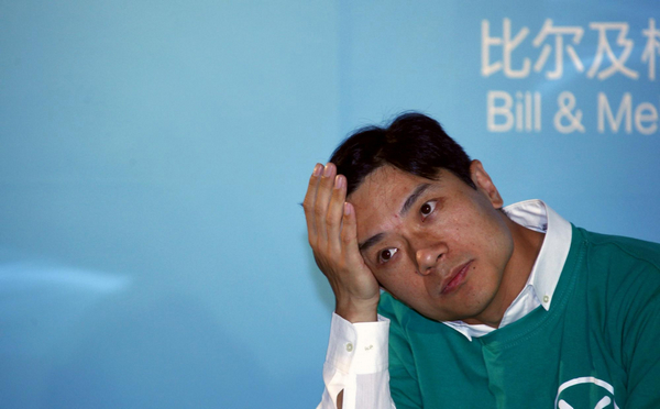 Robin Li, founder and chief executive of Chinese search engine Baidu, listens as Bill Gates (not pictured), Microsoft Corp co-founder and co-chair of the Bill and Melinda Gates Foundation, speaks during a media conference in Beijing June 11, 2011. Bill Gates in China push against secondhand smoke