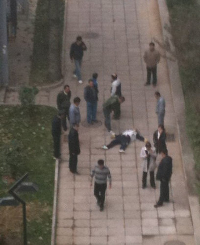 A garbage collector lies unconscious on the ground after fighting with a student over a parking dispute, Dec 5, 2011. Man dies after fight at famous film academy