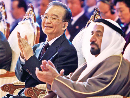 Premier Wen Jiabao and the ruler of Sharjah, Sultan bin Mohammed al-Qassimi, attend the Arab-China Business Conference in the Gulf emirate on Wednesday. Wen's Middle East bonanza