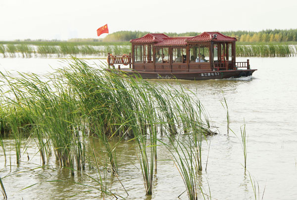 Village rides a wave of change after dam built Village rides a wave of change