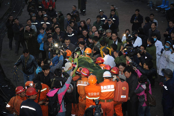 A miner is taken out of a flooded coal mine after being trapped for nearly 60 hours on Monday morning, in Weng'an, Southwest China's Guizhou province. 3 rescued from flooded coal mine in SW China