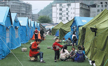 Displaced residents of Baoxing county in the tent city at the local stadium. Photos by Wang Jing / China Daily Life resumes in 'isolated island'