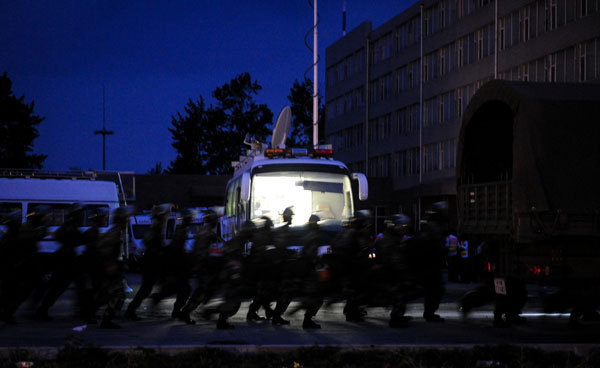 Rescuers are seen at the burnt poultry slaughterhouse owned by the Jilin Baoyuanfeng Poultry Company, June 3, 2013. Poultry plant fire death toll rises to 120