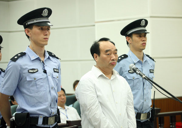Lei Zhengfu, a former official of Chongqing's Beibei district, stands trial on June 19 in a court in the city. Sex video official sentenced to jail in Chongqing