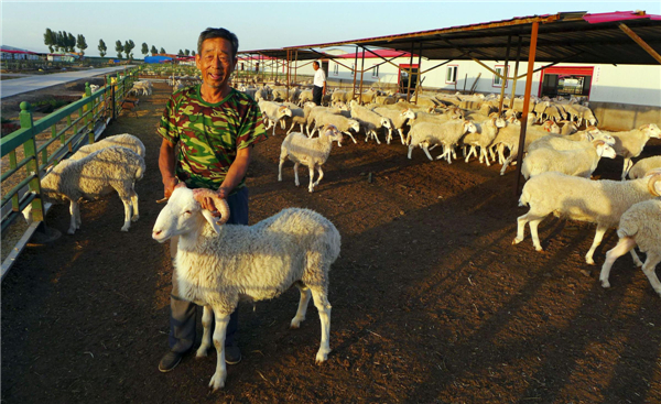 local officials helped him get a bank loan of 180,000 yuan and build a pen N China farmers get help from govt officials