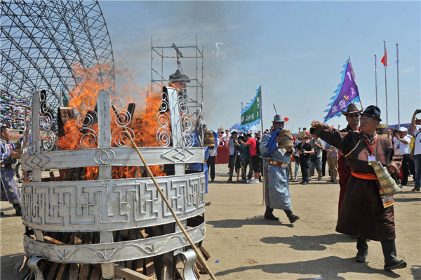 Inner Mongolians burn a sacrificial ritual honoring various gods at the opening ceremony of the 24th Tourism Naadam Festival Naadam Festival trots into town for wild games