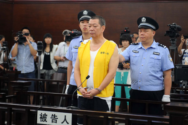 Cai Bin, former senior police officer with Guangzhou's Panyu District, stands trial for taking bribes in Guangzhou, Sept 12, 2013. 'Uncle House' sentenced in S China