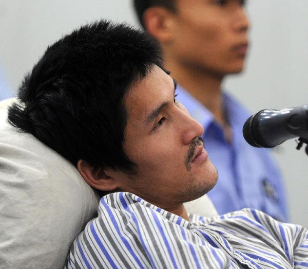 Ji Zhongxing, who is charged with causing a blast in the Beijing Capital International Airport in July, stands trial at the Beijing Chaoyang District People's Court, Sept 17, 2013. Beijing court hears airport blast case