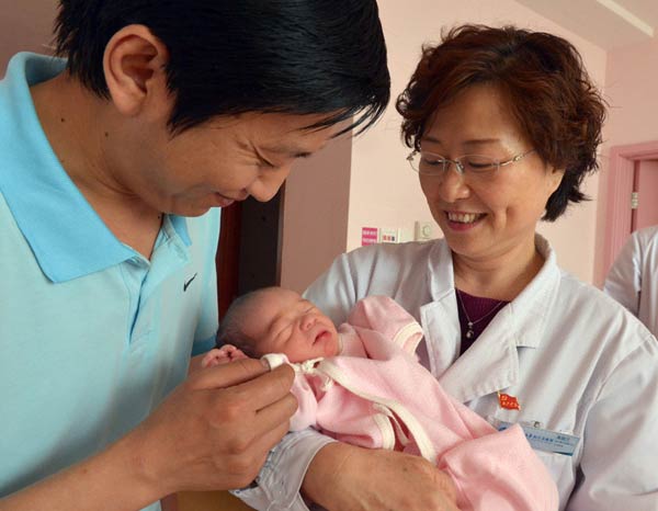 Paralyzed ex-gymnast, new son doing well