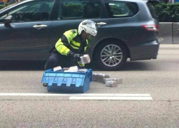 Two arrested in cash spill case in HK