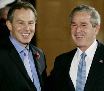 U.S. President George W. Bush greets British Prime Minister Tony Blair (L) at the South Portico of the White House in Washington, November 11, 2004. In talks on Friday, Bush and Blair are expected to focus on the war in Iraq and the middle east peace process, a day after the death of Palestinian leader Yasser Arafat. [Reuters]