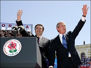US President George W. Bush (R) and Georgian President Mikhail Saakashvili wave to a crowd in Tbilisi. A possible hand grenade was reportedly thrown toward a stage in Georgia where Bush was giving a speech, but the device was taken away by a Georgian security officer, the US Secret Service said(AFP