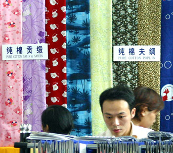 Senior Chinese and U.S. officials met for annual trade talks in Beijing on Monday after a second round of technical discussions to try to resolve a dispute over Chinese textile exports failed to make any breakthrough.