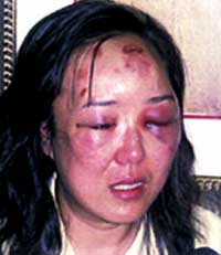 The Chinese businesswoman at the center of a criminal case against a border officer gave a tearful account of the encounter in federal court Tuesday in Buffalo, the Associated Press reported.