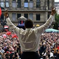 German Chancellor Gerhard Schroeder waves to the crowd after his speech at an election campaign rally in Frankfurt, central Germany September 17, 2005.