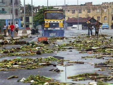 Cubans workers clean Havana's seafront boulevard after Hurricane Rita passed near Cuba September 21, 2005.