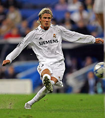 vReal Madrid's Beckham shoots to score against Rosenborg Trondheim during their Champions League soccer match in Madrid