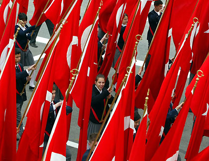 urkish students with flags march during a parade marking the 82nd anniversary of Republic Day in Ankara October 29, 2005.