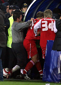 urkey's Emre Belozoglu (L) scuffles with Switzerland's Christoph Spycher and Valon Behrami (R) as they run into the dressing room after their World Cup 2006 European zone, second leg play-off qualifying soccer match at the Sukru Saracoglu stadium in Istanbul, November 16, 2005.