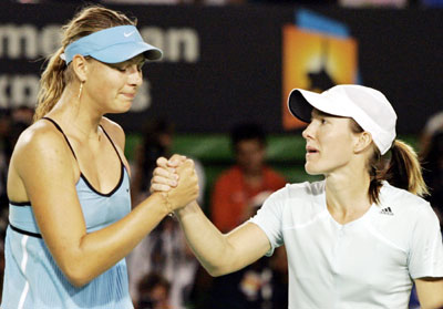 Maria Sharapova of Russia (L) and Justine Henin-Hardenne of Belgium shake hands at the conclusion of their match at the Australian Open tennis tournament in Melbourne January 26, 2006.
