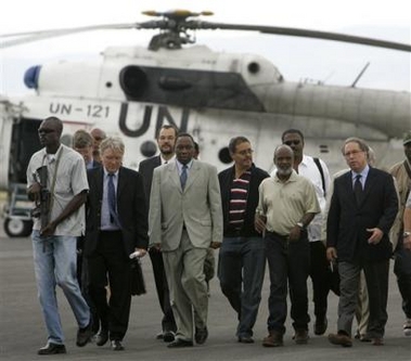 Haitian presidential candidate Rene Preval, second right, listens to U.N. special envoy to Haiti Juan Gabriel Valdes, right, upon his arrival from his hometown of Marmelade to the U.N. base in Port-au-Prince, Haiti, Monday, Feb. 13, 2006.