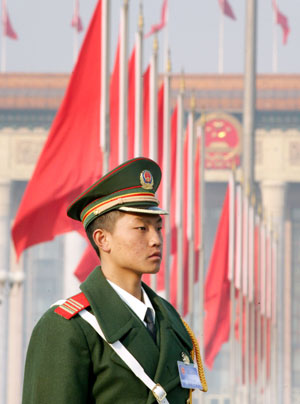 A Chinese paramilitary policeman stand guard outside the Great Hall of the People in China's capital Beijing March 4, 2006. The National People's Congress, an annual two-week government gathering in Beijing where major policy decisions are made, will start on Sunday.
